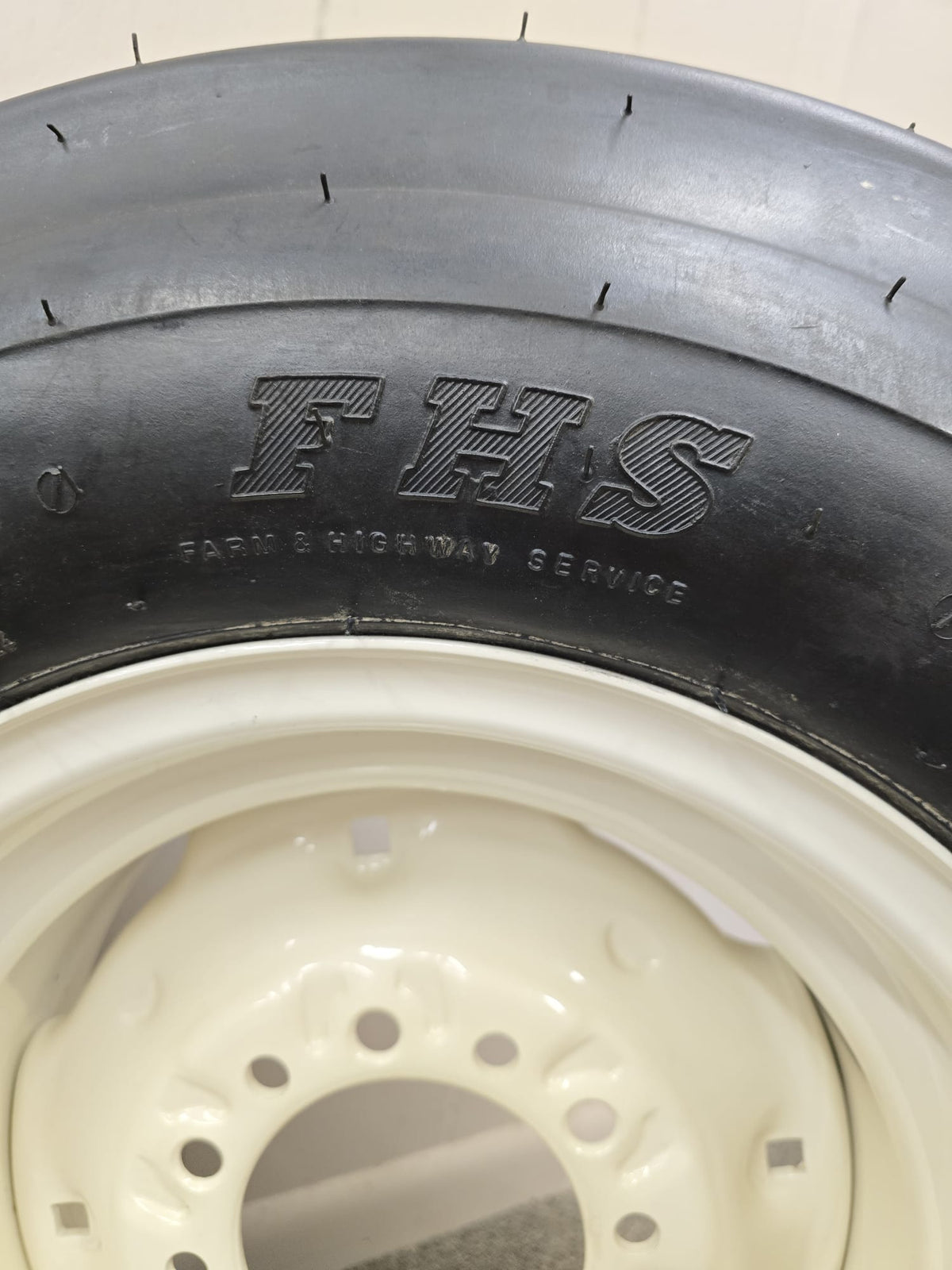 Assembly: 11‑15 F‑Ply Tire on  6‑Hole wheel for high‑speed DOT use . - AG Machinery Depot