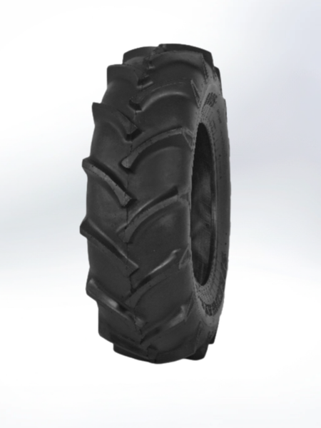 A black heavy-duty tractor tire with deep, angled lugs for high traction, shown against a plain white background.
