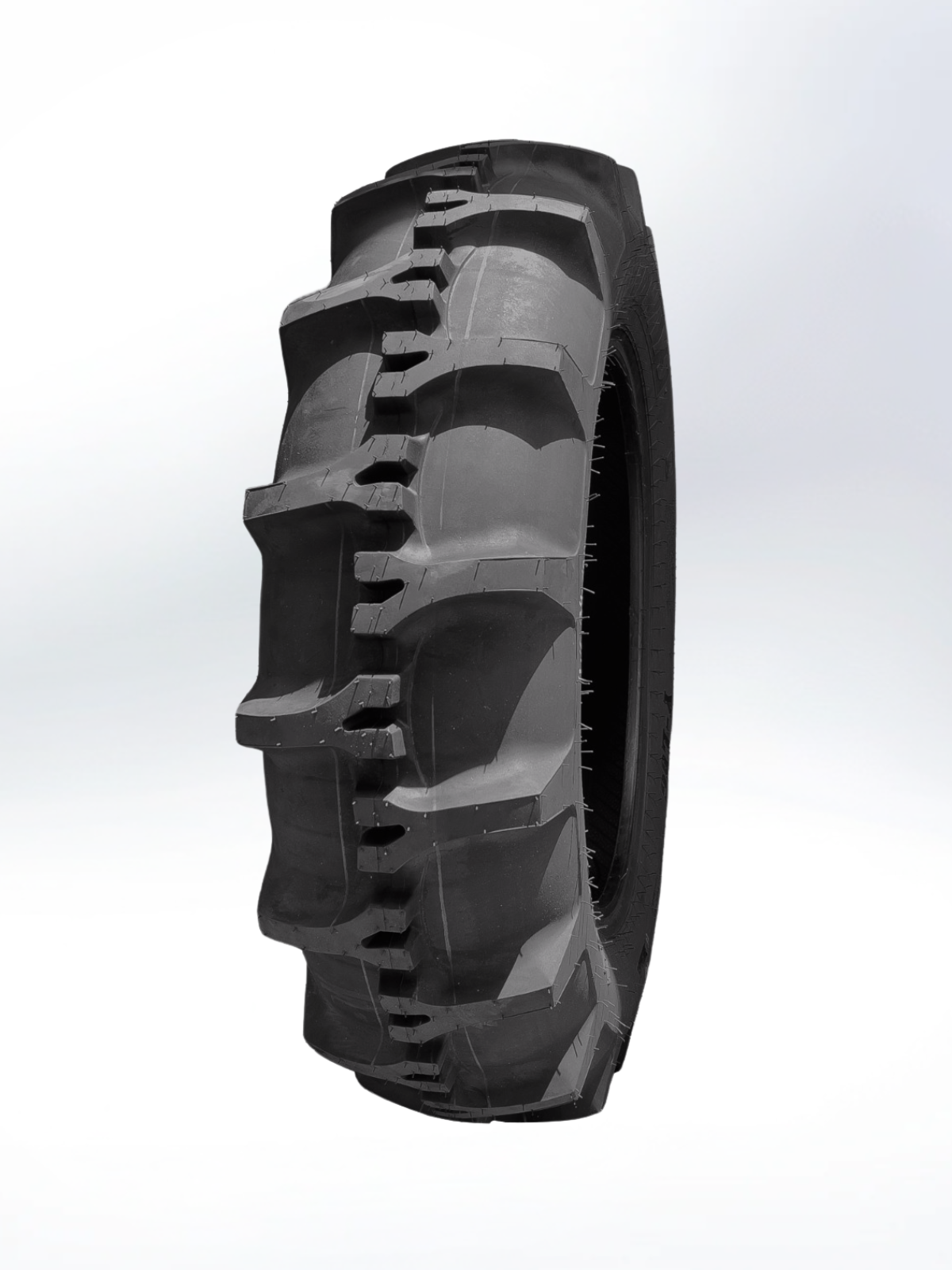 Tire with a prominent tread pattern on a white background