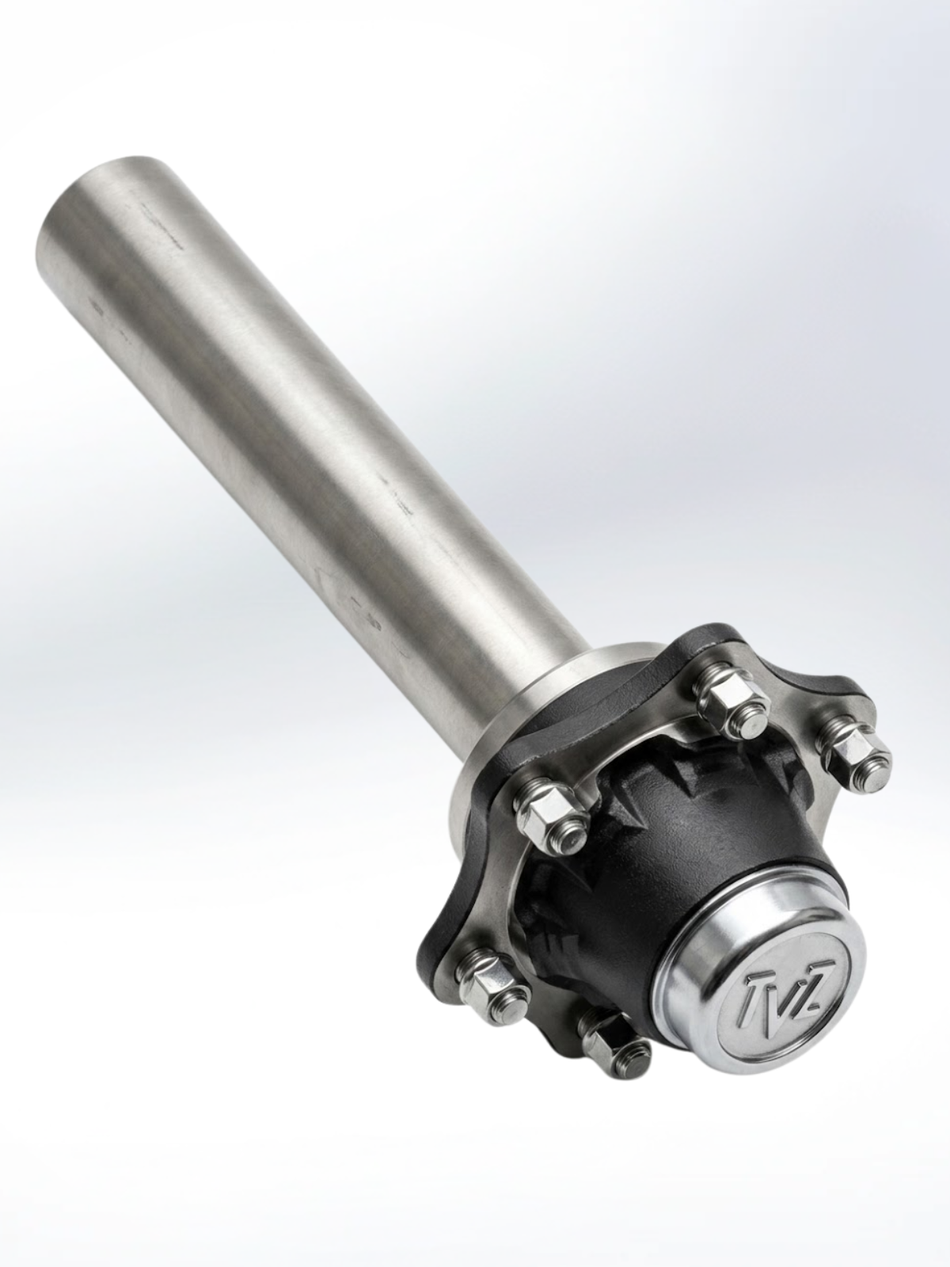An industrial-grade metal axle spindle and hub assembly against a plain white background. It features a long, smooth silver cylindrical shaft connected to a black circular hub with five protruding silver bolts and nuts. The end of the hub is capped with a silver dome embossed with a stylized "TVZ" logo.