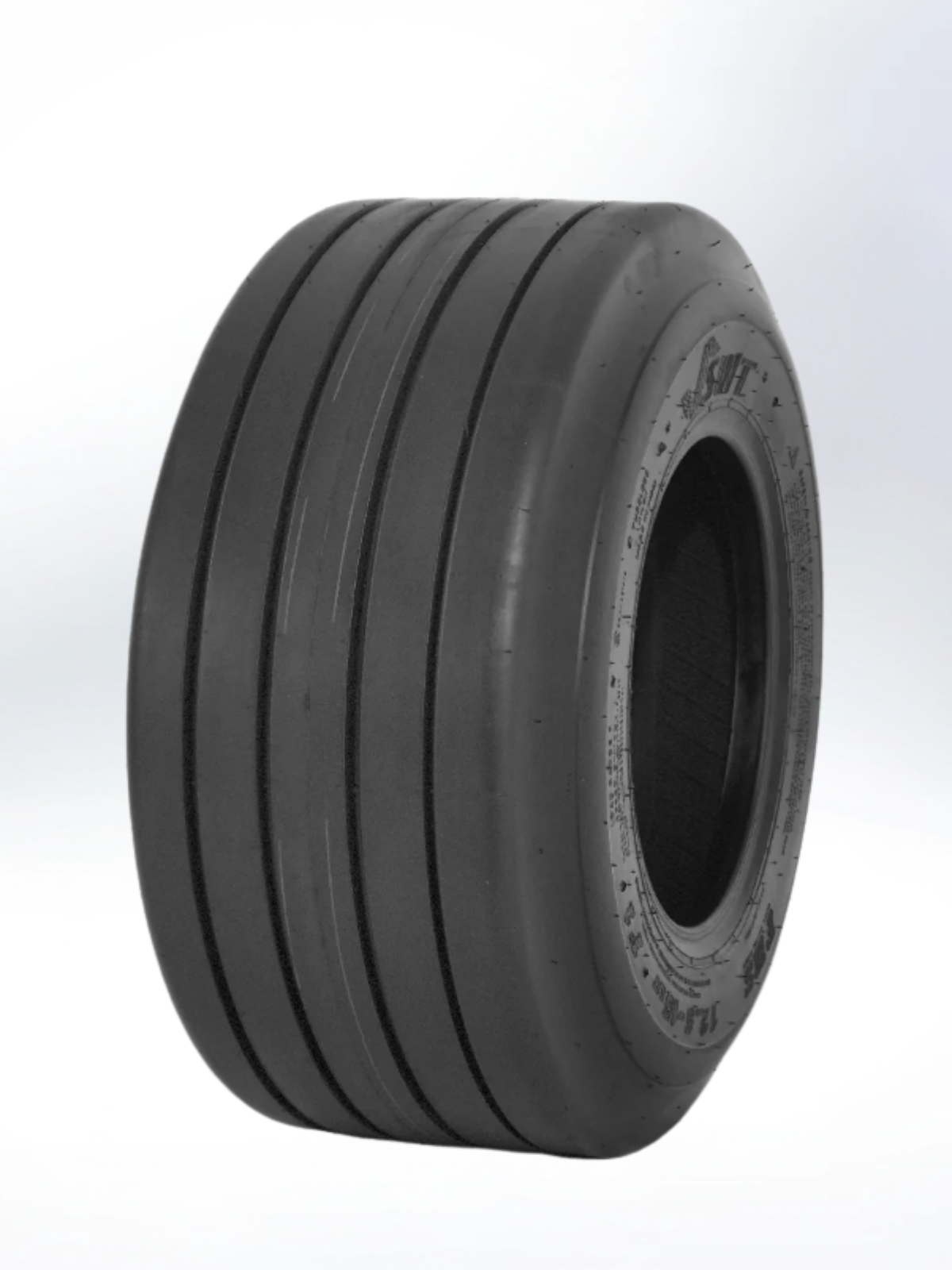 Black industrial tire on a white background. Tire, 11L-16, PR - 12, Implement, TL, US Standard, I-1 Pattern