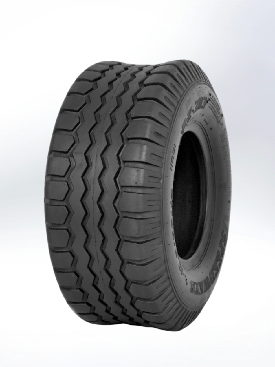 Black tire with tread pattern on a white background. Tire, 12.5/80-15.3, PR - 22, Implement, Extra Load, TL, EU - European Standard, PK 303 Pattern