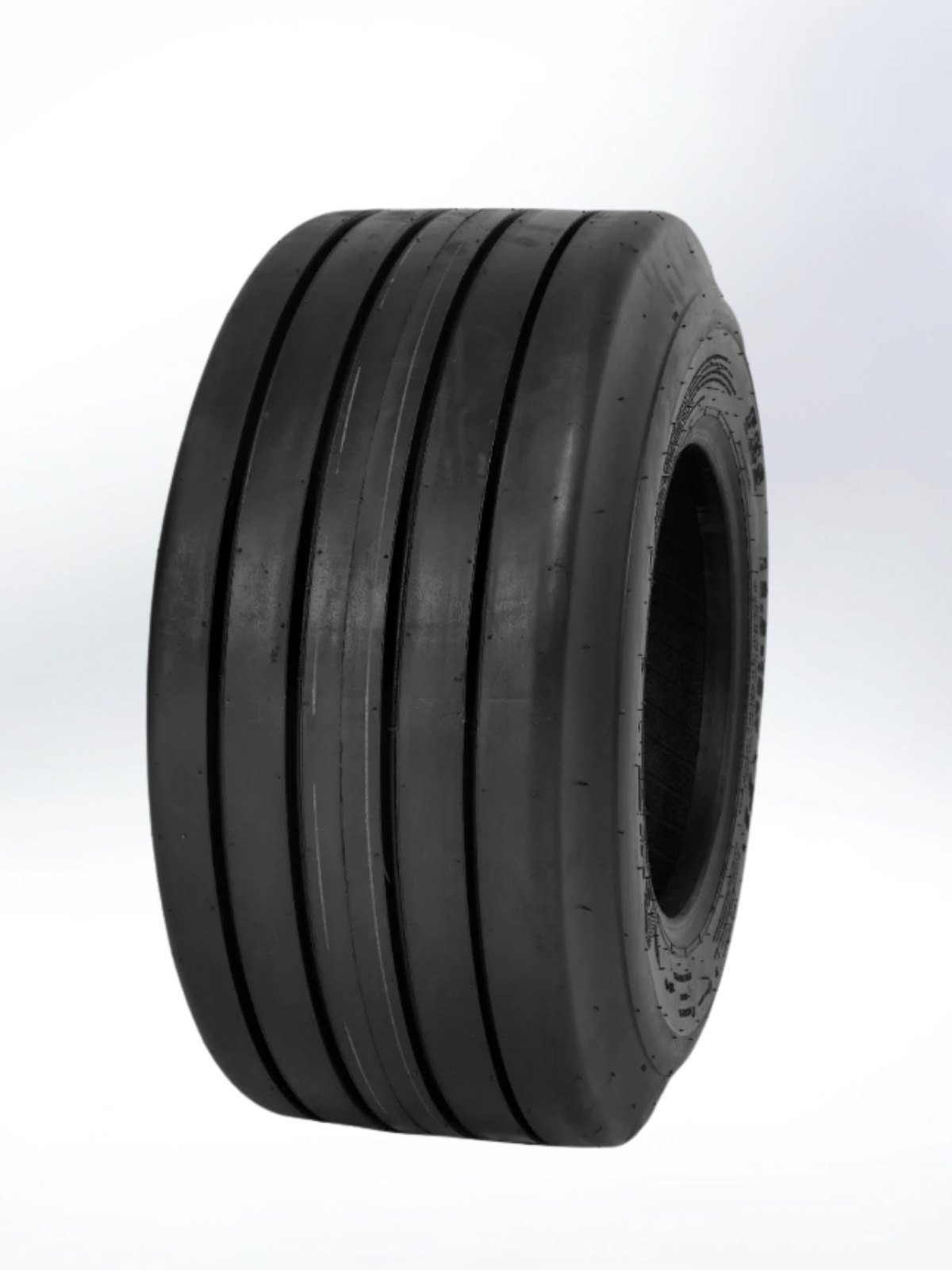 Black tire with tread pattern on a white background. Tire, 9.5L - 15FI FHS FPLY Implement, TL, I-1 Pattern DOT 60 MPH